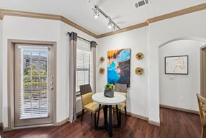 Conroe apartment for rent - A dining room with a table and chairs.