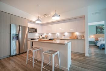 Oversized kitchen islands with quartz countertops