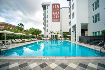 Refreshing outdoor pool with covered pool bar lounge