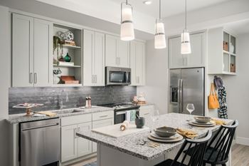 Smart home package with sleek induction cooktop island in select units