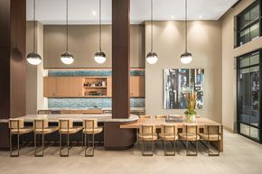 Arlington apartment for rent - A modern dining room with a long table and chairs.