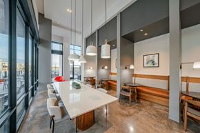Houston apartment for rent - A modern dining area with a long table and chairs.