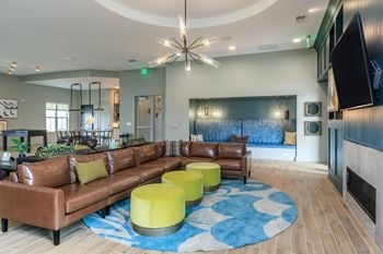 French-country inspired clubhouse with kitchenette, coffee bar, lounge seating & cozy fireplace