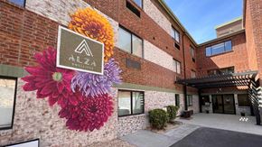 El Paso apartment for rent - a mural of three flowers on the side of a building