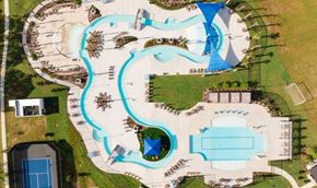 Rosharon apartment for rent - A large outdoor swimming pool complex with a lazy river and multiple pools.