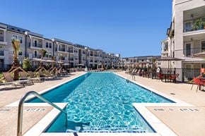 Georgetown townhouse for rent - A long rectangular pool in the middle of a resort.
