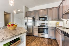 Highland Village apartment for rent - a kitchen with stainless steel appliances and granite counter tops