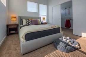 Denver apartment for rent - a bedroom with a bed and a closet