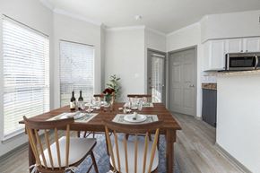 Granbury apartment for rent - a kitchen and dining room with a wooden table and chairs