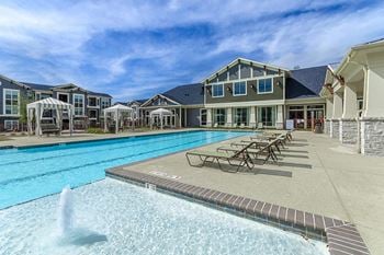 Resort style pool with sun deck & cabanas