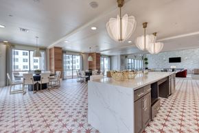 San Antonio apartment for rent - a large kitchen with a marble counter top and a dining room