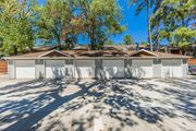 Houston apartment for rent - A house with a brown roof and a white garage door.
