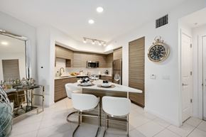 Boca Raton apartment for rent - a kitchen and dining area with a table and chairs