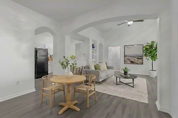 Temple apartment for rent - A modern living room with a wooden table and chairs.