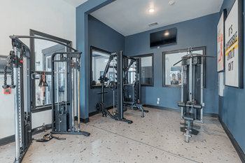 24/7 Fitness center with cardio and free weights