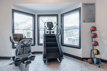 24/7 Fitness center with cardio and free weights