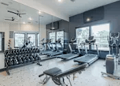 24/7 Fitness center with cardio and free weights