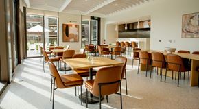 Atlanta apartment for rent - A large dining room with a long table and chairs.