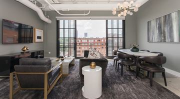 Atlanta apartment for rent - A living room with a grey sofa and a white coffee table.