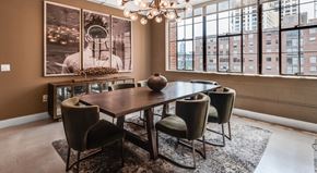Atlanta apartment for rent - A dining room with a table and chairs and a chandelier.