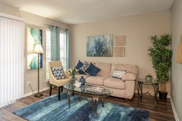 Dallas apartment for rent - a living room with a couch and a table