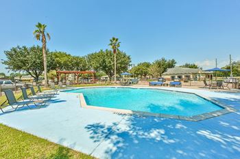 Sparkling pool with nearby pergola