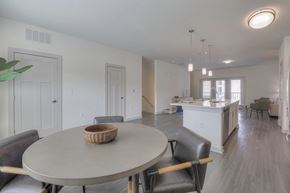Nashville apartment for rent - A dining room with a round table and chairs.