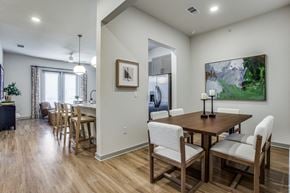 Fort Worth apartment for rent - A dining room with a wooden table and chairs.