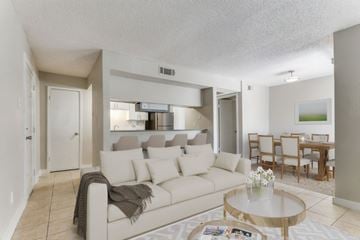 Arlington apartment for rent - A living room with a white couch and a coffee table.