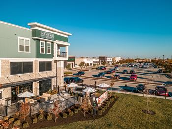 Next to shops & restaurants