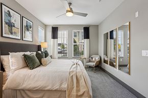 Franklin apartment for rent - A bedroom with a large bed and a ceiling fan.