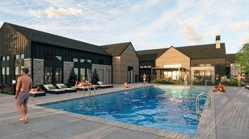 Crystal Lake apartment for rent - A man is standing by the poolside in a sunny day.