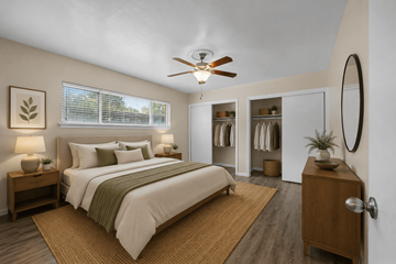 Austin apartment for rent - A bedroom with a large bed and a ceiling fan.