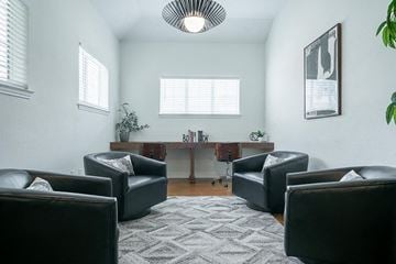 Killeen apartment for rent - a living room with leather chairs and a rug