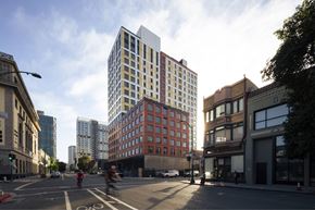 Oakland apartment for rent - a rendering of a city street with tall buildings