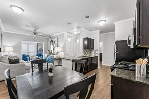 San Antonio apartment for rent - A modern kitchen with a black table and chairs.