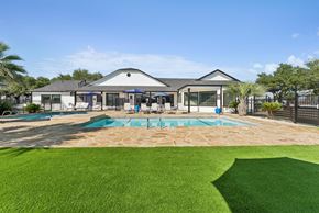 San Antonio apartment for rent - A large house with a pool in the backyard.