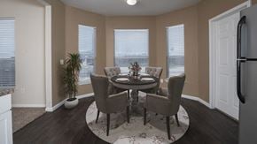 Houston apartment for rent - a dining room with a table and chairs