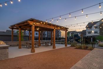 Outdoor kitchen with barbeque grills and pergola