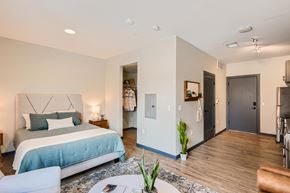 Fort Collins apartment for rent - A bedroom with a bed, a couch, and a chair.