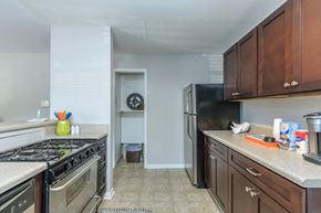 Atlanta apartment for rent - a kitchen with wood cabinets and stainless steel appliances