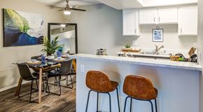 Ontario apartment for rent - A kitchen with a dining table and chairs.