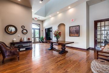 Shreveport apartment for rent - a living room with a hard wood floor and a table