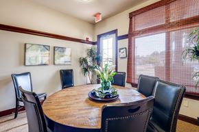 Shreveport apartment for rent - a dining room with a wooden table and leather chairs