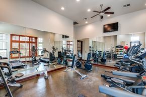 Shreveport apartment for rent - the gym has plenty of exercise equipment including treadmills and ellipticals