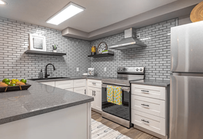 Longview apartment for rent - a kitchen with white cabinets and stainless steel appliances