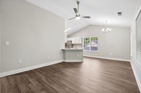Aberdeen townhouse for rent - A room with a ceiling fan and light fixture.