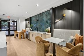 Atlanta apartment for rent - A modern dining area with a table and chairs.
