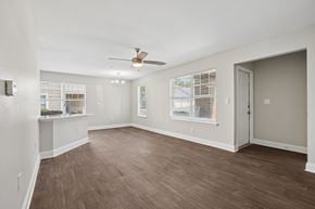 Aberdeen townhouse for rent - A room with a ceiling fan and wooden flooring.