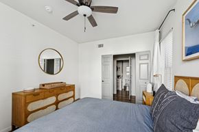 Austin apartment for rent - A bedroom with a bed, dresser, and mirror.
